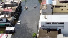 People caught up in the middle of a flood in Mexico