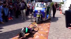 Animal rights groups slam event where pit bull is forced to pull tuk-tuk with six Thai models inside