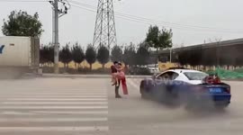 Bride and groom have luxury car do doughnuts around them to celebrate wedding in China