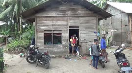 Fisherman attacked by 10ft long crocodile after catching it in his net in Indonesia