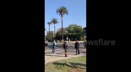 Protesters rally outside LA mayor's house amid rumours he may join Biden's team