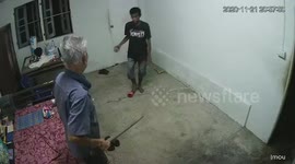 Shocking moment burglar pushes over pensioner in his home in Thailand