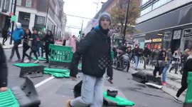 Protesters throw street barriers across road in London anti-lockdown protest