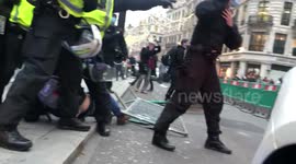 Protestors throw projectiles at police arresting man near Oxford Circus