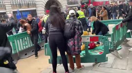 Woman and child shoved to the ground during arrest at protest in London