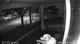 Security camera captures moment US homeowner ducks for cover as vehicles drive past shooting