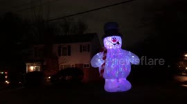 Huge inflatable snowman is taller than house in Maryland