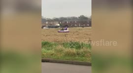 A bizarre video has emerged of a man riding around a housing estate in Hull - on a HOVERCRAFT