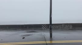Watch as huge waves crash over the sea wall in Maine during a large Atlantic storm