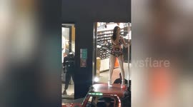 Taiwanese man strapped to stripper's pole and driven through city behind dancer as 'birthday surprise'