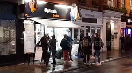 Londoners queue out the door for haircuts in an otherwise quiet Soho as non-essential businesses reopen again