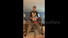 Guy stacks cups under a second