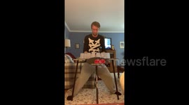 Talented New Yorker stacks 12 cups under a second