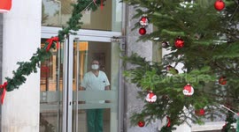 Ambulances rush carrying COVID cases as Christmas decorations take place at hospitals to boost morale
