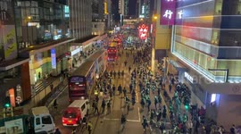 The police chase after protestors after they blocked the traffic at the anti-government protest on June 9 2020