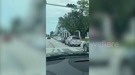 Huge queue of cars seen waiting for COVID-19 test in Miami