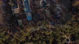 Aerial view of a pool, swimming pool and spa in deterioration due to being abandoned and burned, located in the rural area of Real del Alamito in Sonora, Mexico ...