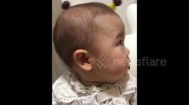 Adorable infant gets flustered