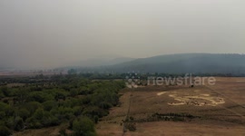 Smoke from wildfires blankets the sky of Tasmania - Aerial Footage