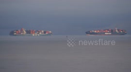 Brexit - two large container-ships pass in Thames Estuary, Kent, UK