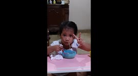 Four Years Old Girl Posed For Pictures While Eating Noodle