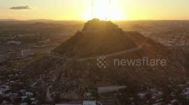 Aerial view of Cerro de la Campana at sunset and the Hacienda de La Flor, Revolucion colonies on December 10, 2020 in Hermosillo, Mexico. .