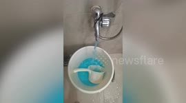 Strange neon-blue water comes out of tap in Philippines