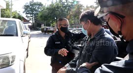 Humiliating moment man is forced to pose with hundreds of stolen bras