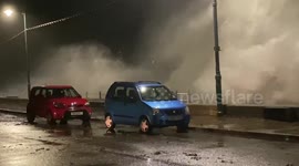 Massive waves smash against seafront in Cornwall, UK