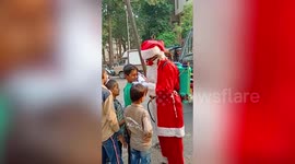 Santa distributes masks to spread awareness about COVID-19 in India