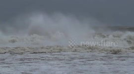 Watch as huge Atlantic surf crashes onto the New York coast as Storm Gail strikes North-eastern parts of the US