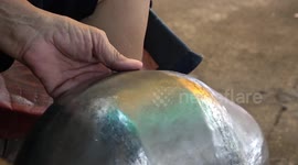 Craftsmen use ancient technique to make 'alms bowls' for Buddhist monk donations