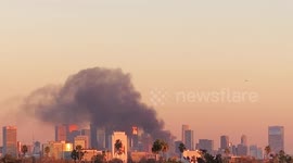 DTLA Structure fire at sunset with big plume of black smoke part 2 4k