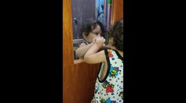 Baby looking at the mirror