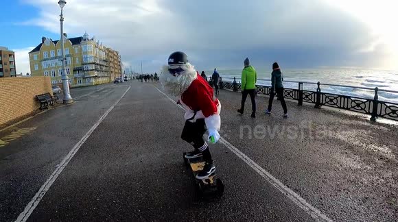 'Santa Cruise' delivers presents to kids in UK while riding electric skateboard