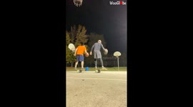 Friends doing baskets while standing on balance boards