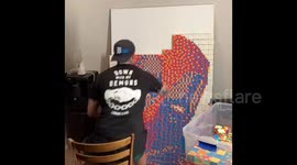Deadpool mosaic done in approximately 4 and a half hours using 594 speedcubes.