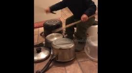 Like father, like son! 18-month old beautifully bangs pots and pans like his drummer dad