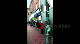 UK shoppers queue round the block for last minute supplies on Christmas Eve