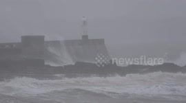 Thrillseekers climb onto rocks to watch Storm Bella roll into South Wales