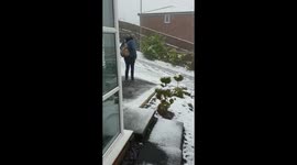 Teenager Slips Down a Steep Drive In The Snow