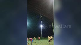 Snake Climbing Up Fence Interrupts Football Game