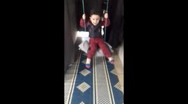 HamedoMuhammad Khair al-Dimashqi, a child who was displaced from his country, Damascus, steals moments of joy with a swing made of worn threads.