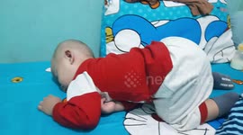 Baby Sleeping While Face Down Action in West Jakarta. Indonesia