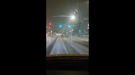 Truck sliding on ice during snowstorm in Denver