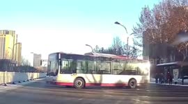 Bus spins out of control on icy road in northern China