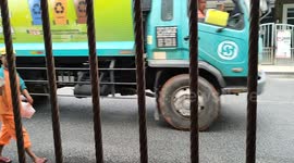 Toddler gets excited yet nervous to see garbage truck