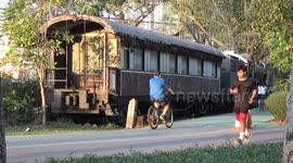 Healthy start to 2021, people running, walking and cycling in a park at sunset.