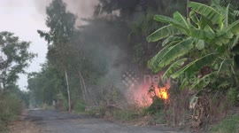Mysterious fire on a deserted rural road burned with amazing intensity and mostly in silence, not sure what was fueling this fire.