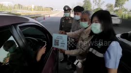 Drivers checked for COVID-19 symptoms after surge in cases in Thailand
